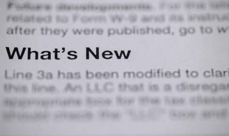 Close up of book text focused on the words "What's New" associated with New York real estate law updates in 2025.