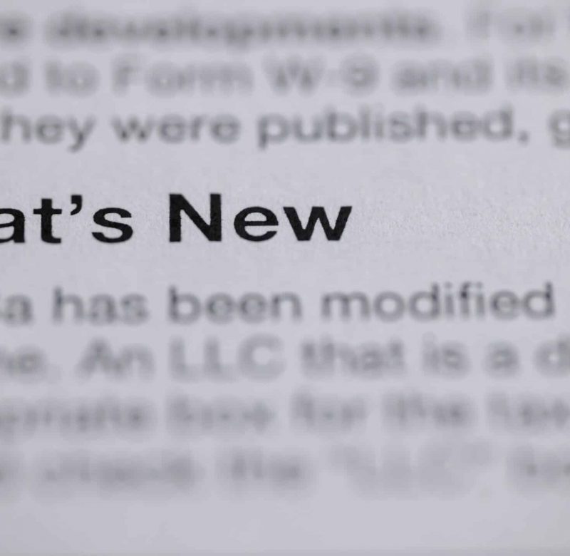 Close up of book text focused on the words "What's New" associated with New York real estate law updates in 2025.