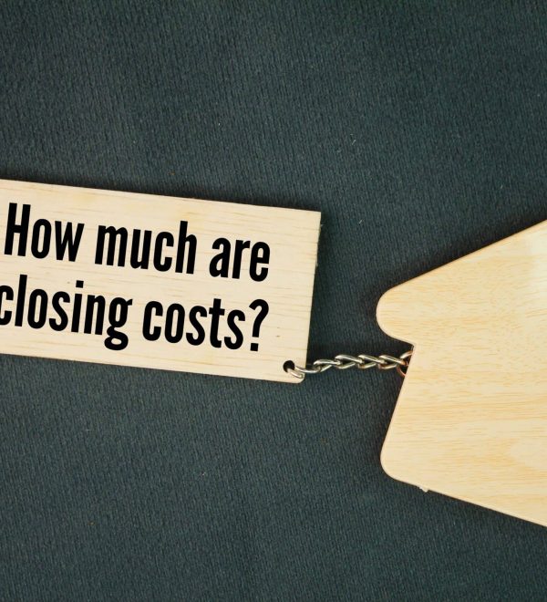 Wood tag asking a common question related to residential closings in New York.